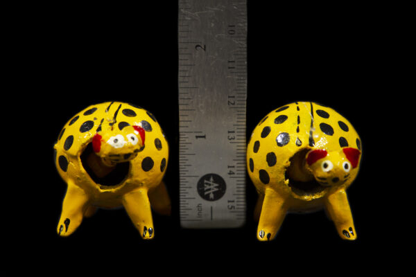 Two Yellow LooseNeck Cheetah Figurines next to ruler for size comparison