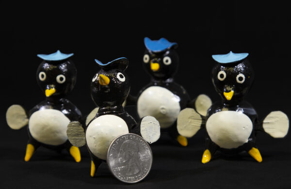 LooseNeck Penguin Figurines with quarter size comparison