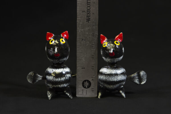 Two LooseNeck Owl Figurines next to ruler for size comparison