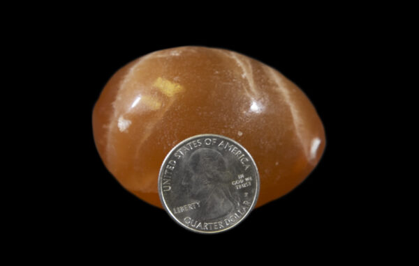 Orange Onyx Egg with coin for size