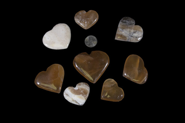 plain aragonite hearts with quarter to scale