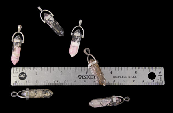 rhodonite pendants being measured