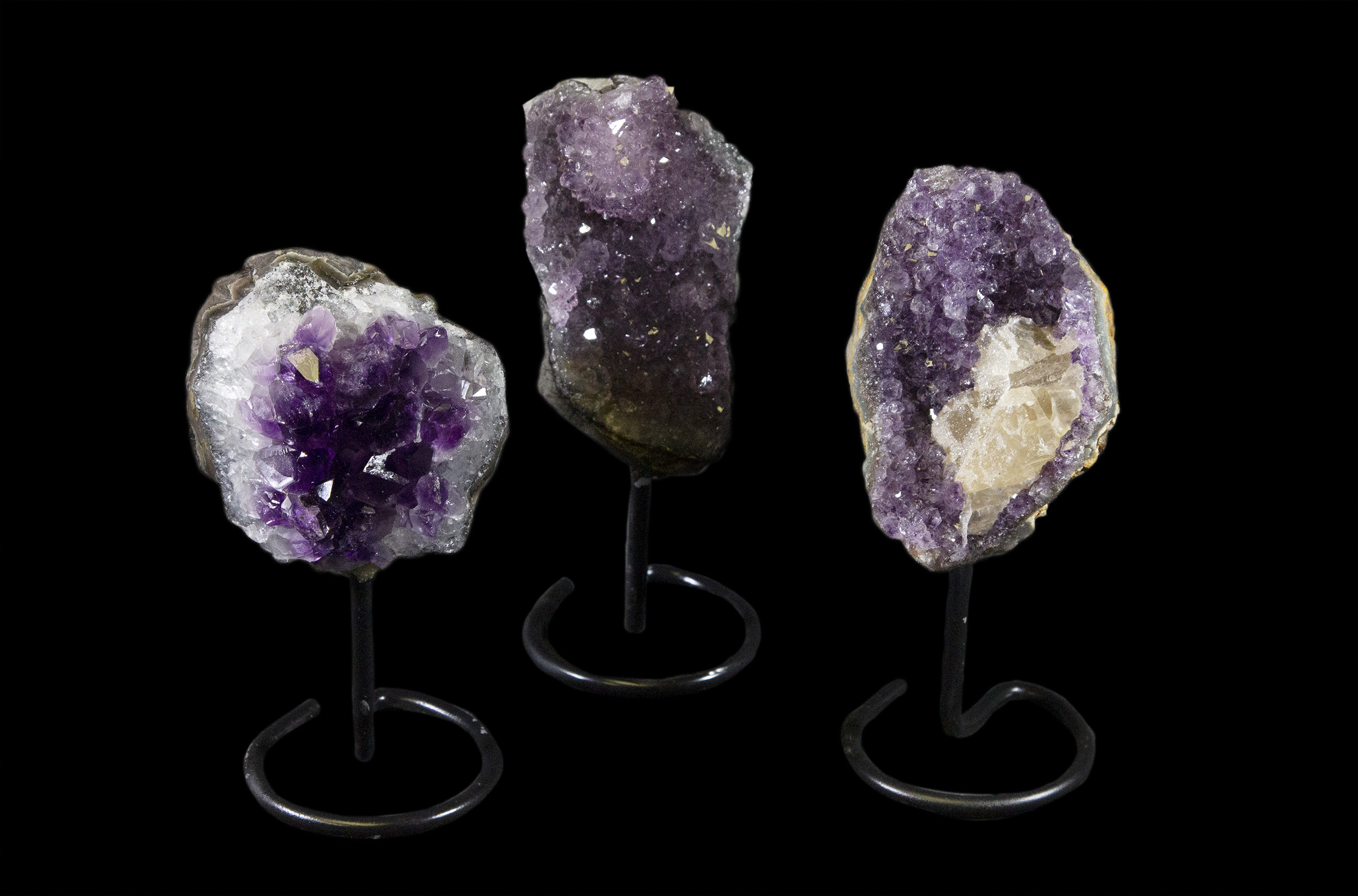 Three Amethyst Stones on a Stand