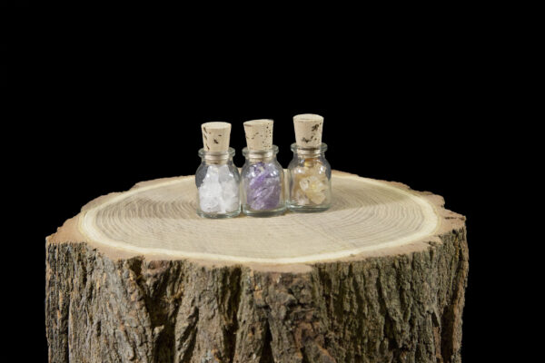 jar trio on wood slice