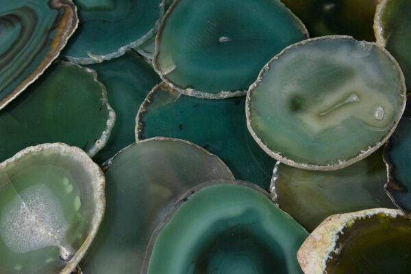 Pile of green agate coasters