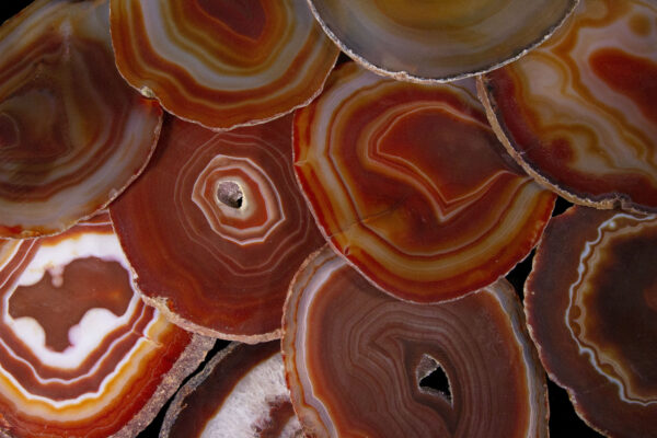 pile of red agate coasters