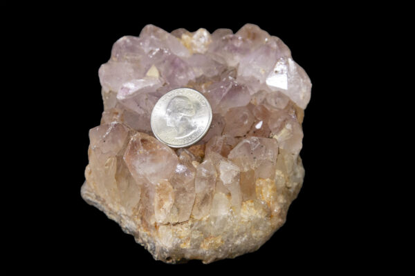 orange and pink amethyst with quarter to scale