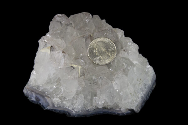 crystal quartz cluster with quarter to show scale