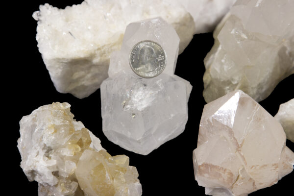 crystal clusters with quarter to show size