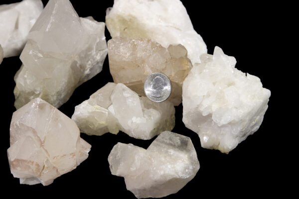 crystal clusters with quarter to show size