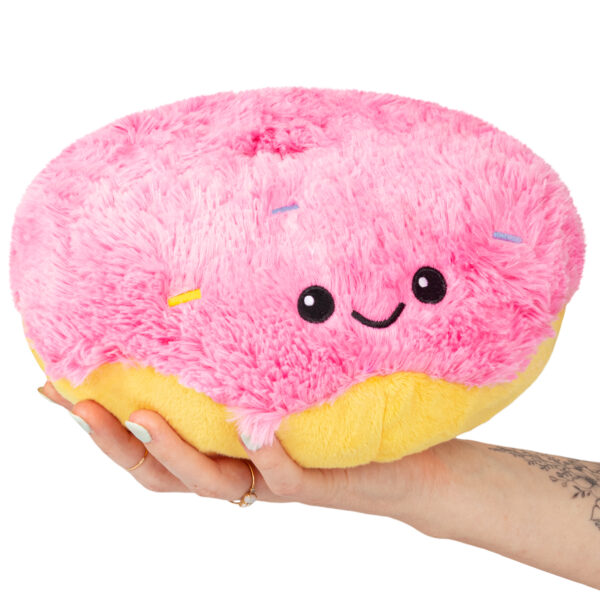 Hand holding Mini Squishable Pink Donut