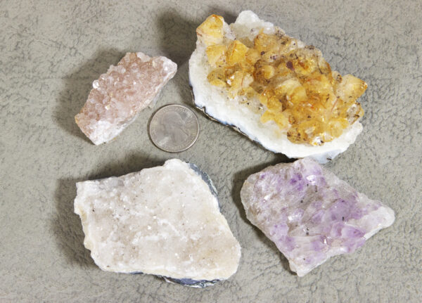 set of four amethyst - orange, pink, purple, and white with quarter to show size