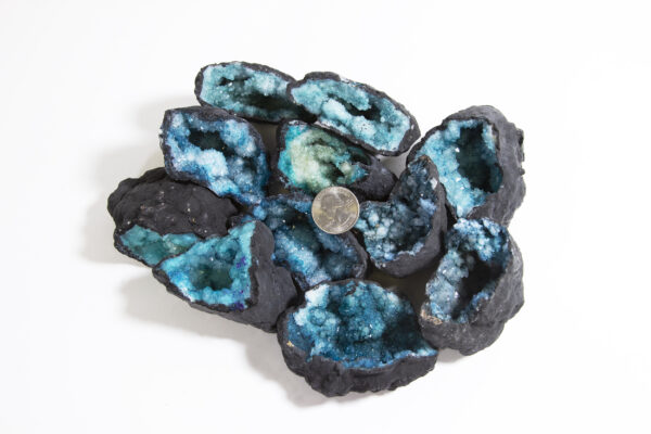 Assorted medium teal dyed geode with quarter to show scale