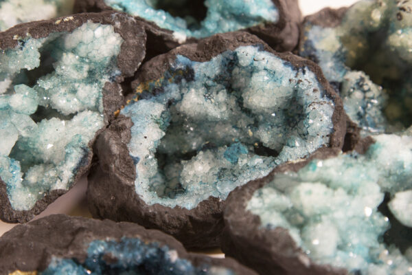 assorted large teal dyed geodes close up