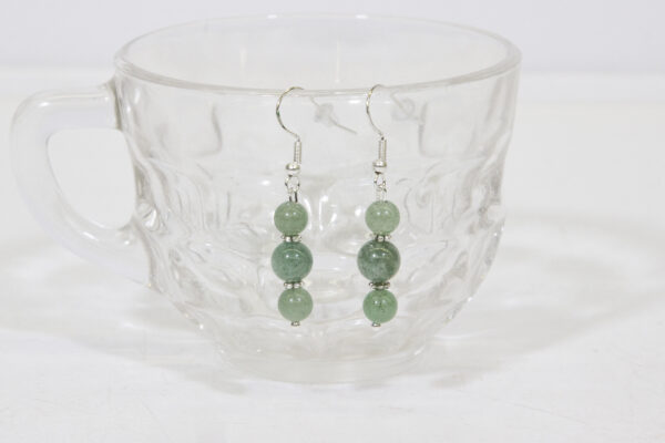 Aventurine Earrings hanging on a glass cup