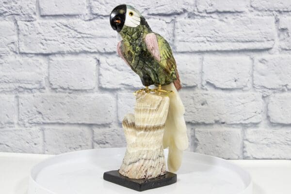 Green and Pink Hand Craved Tropical Parrot with White Base Front View