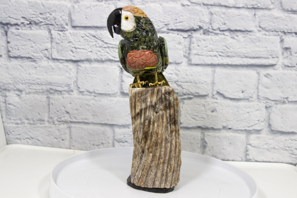 Green and Red Hand Craved Tropical Parrot with Brown Base Front View
