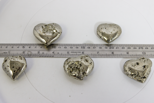 Five Pyrite Hearts 1.5" next to Ruler for measuring