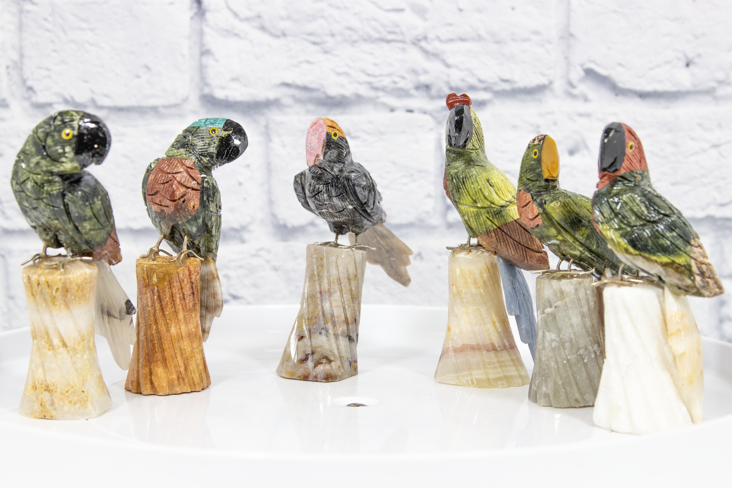 Several Hand Carved Parrots on Natural Gemstone